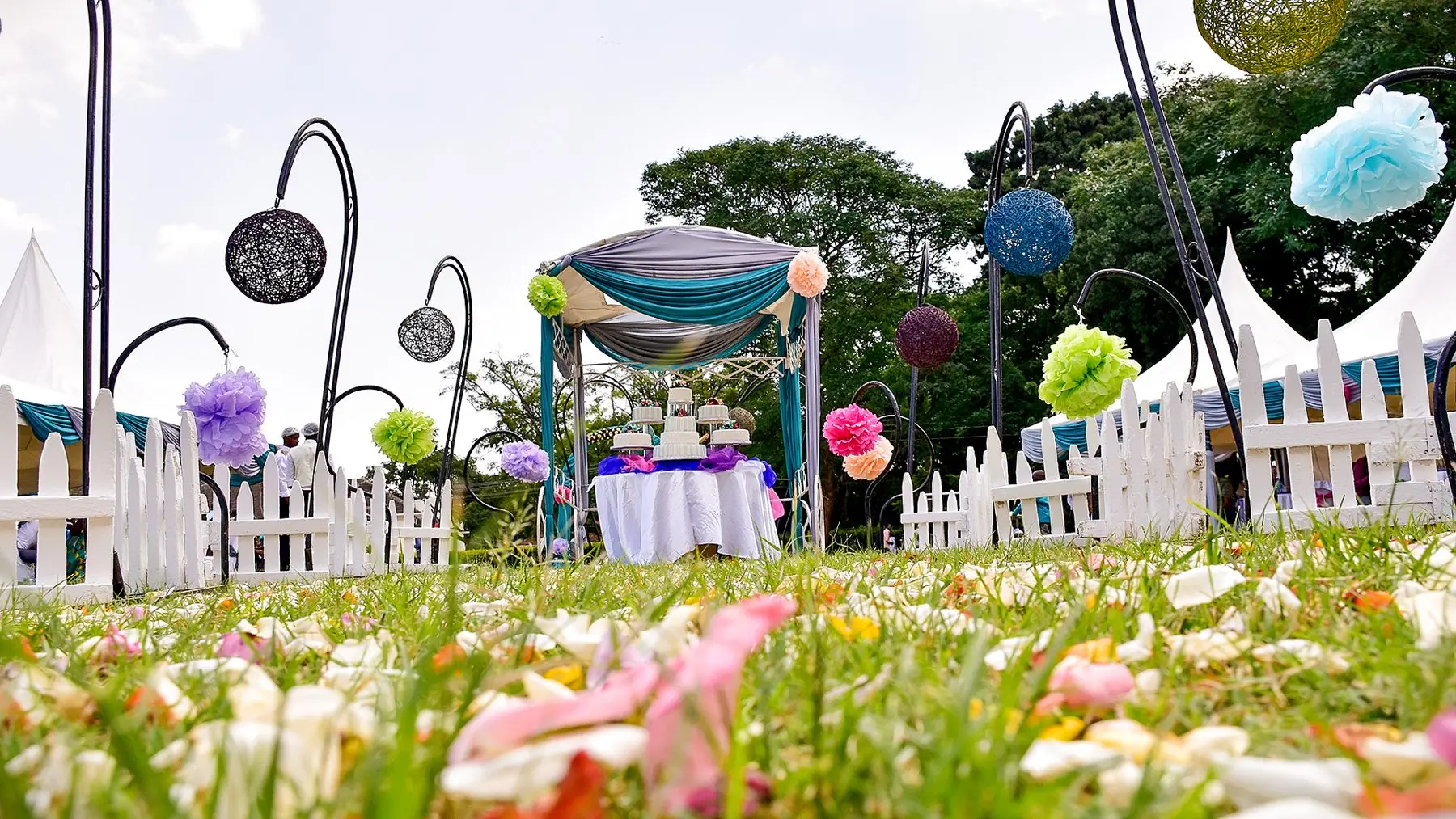 Garden reception decor with a tiered cake