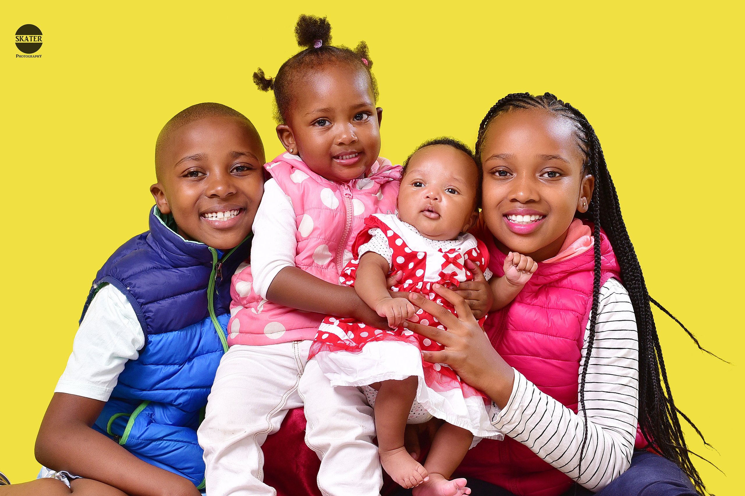 Siblings yellow backdrop – studio portrait photography by Skater Photography, Nairobi